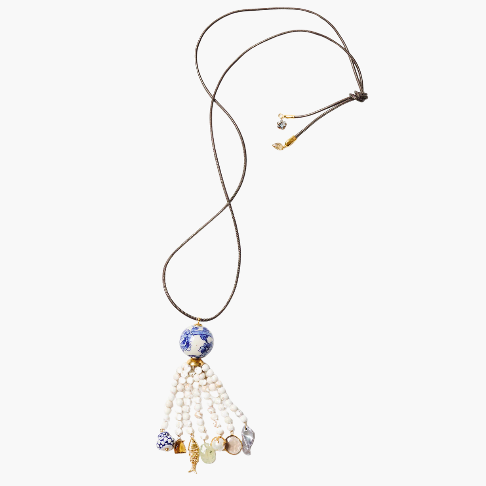Necklace with beads and tassel on a white background