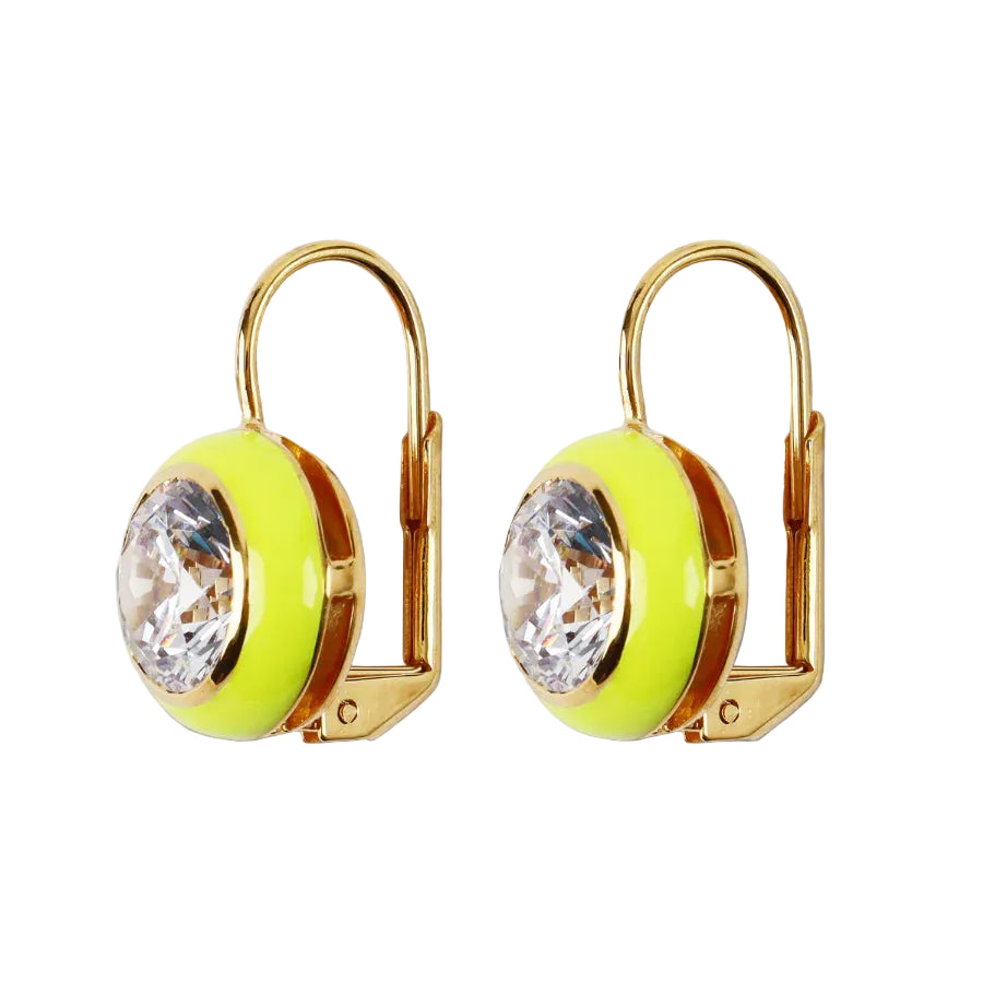 Gold earrings with neon green circular stones and clear crystals on a beige background
