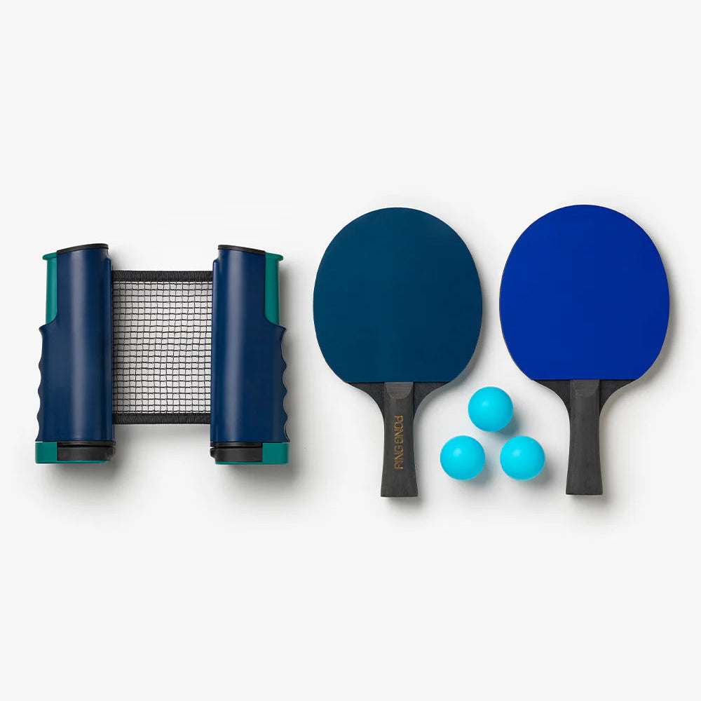 Ping pong paddle set with paddles, net, and balls on a white background