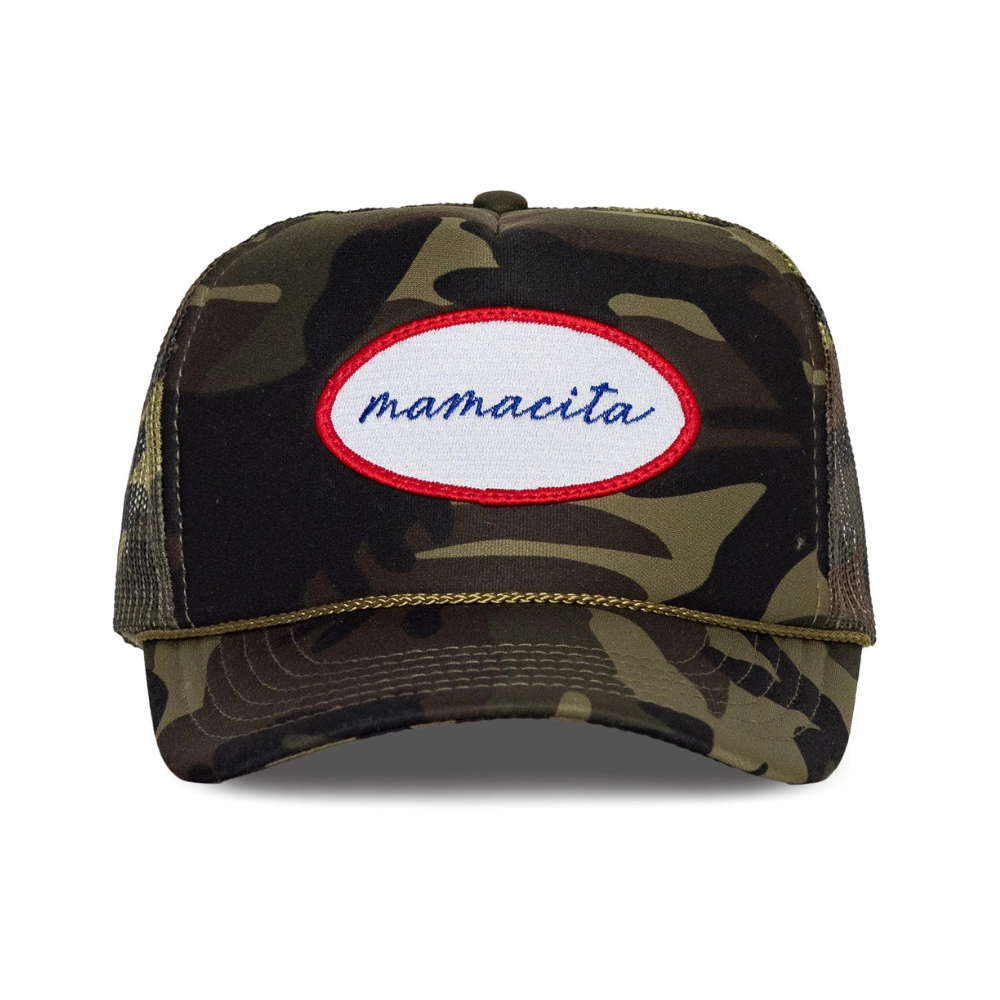 Camouflage trucker hat with 'mamacita' patch on a white background