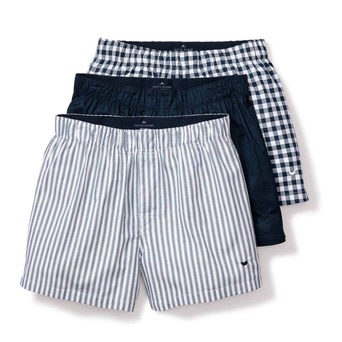 Three pairs of men's underwear with different patterns on a white background