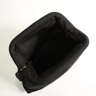 Black plastic tray with multiple small cups on a white background
