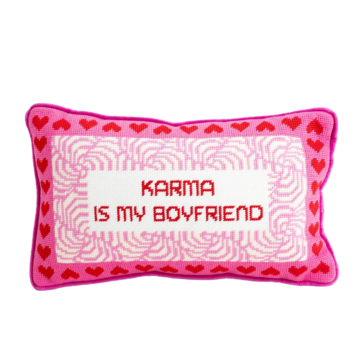 Decorative pillow with 'Karma is my boyfriend' text and heart patterns on a white background