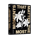 Book titled 'Moments That Matter the Most' with floral design on a black background