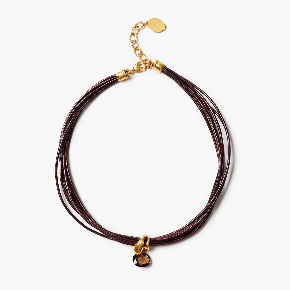 Brown leather cord necklace with gold clasp on a white background