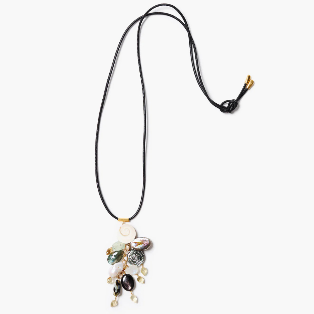 Necklace with various beads and charms on a white background