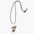 Necklace with various beads and charms on a white background