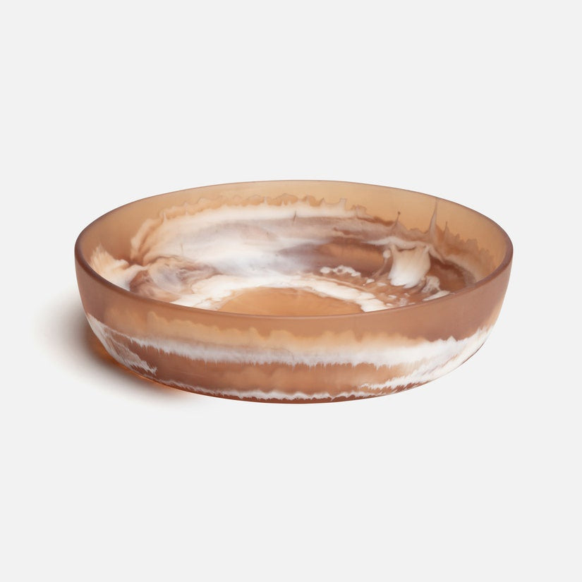 Decorative bowl with brown and white marbled pattern on a light gray background