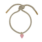 Bracelet with pink heart charm on a white background