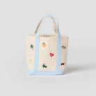Tote bag with embroidered designs on a light gray background