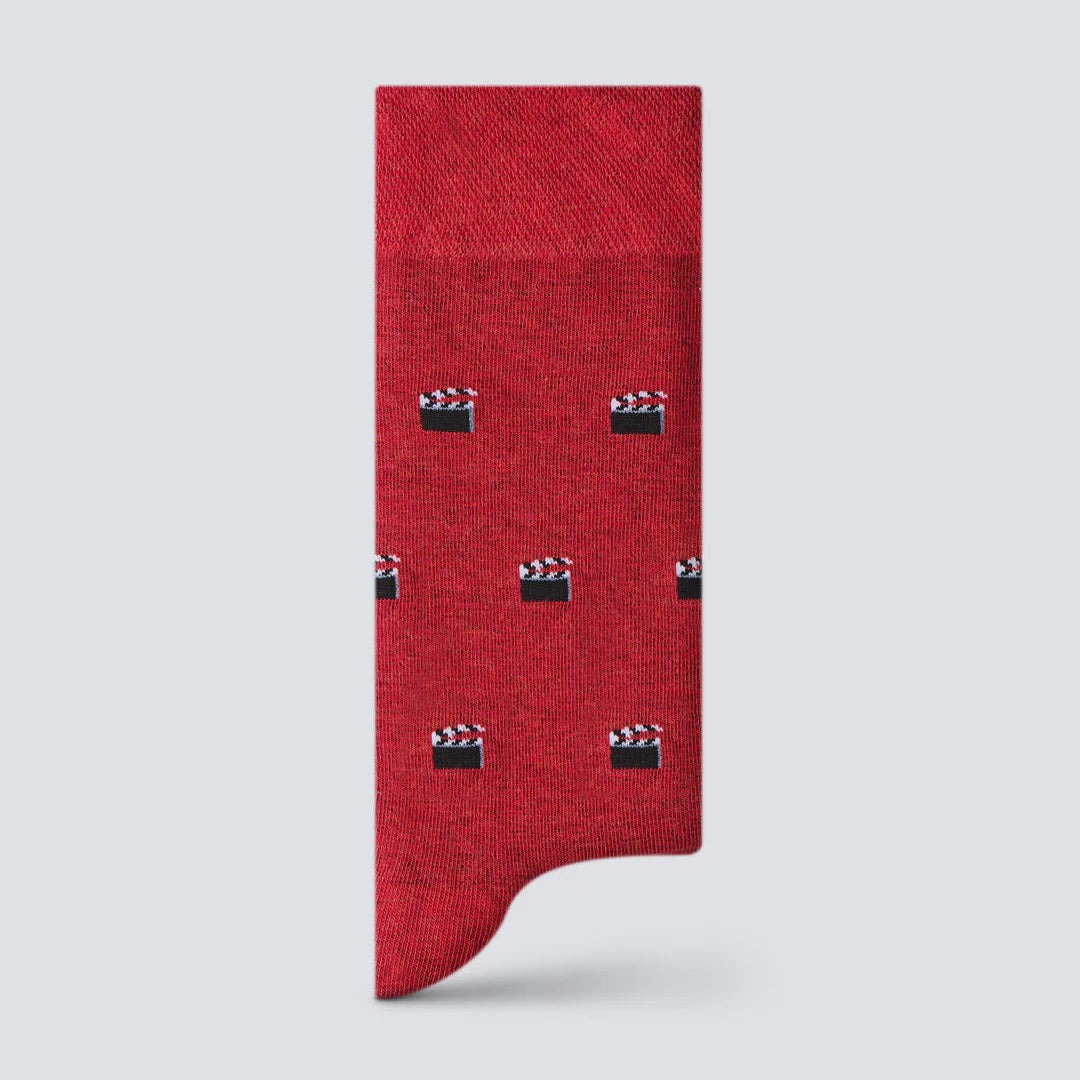 Red sock with clapperboard pattern on a light gray background