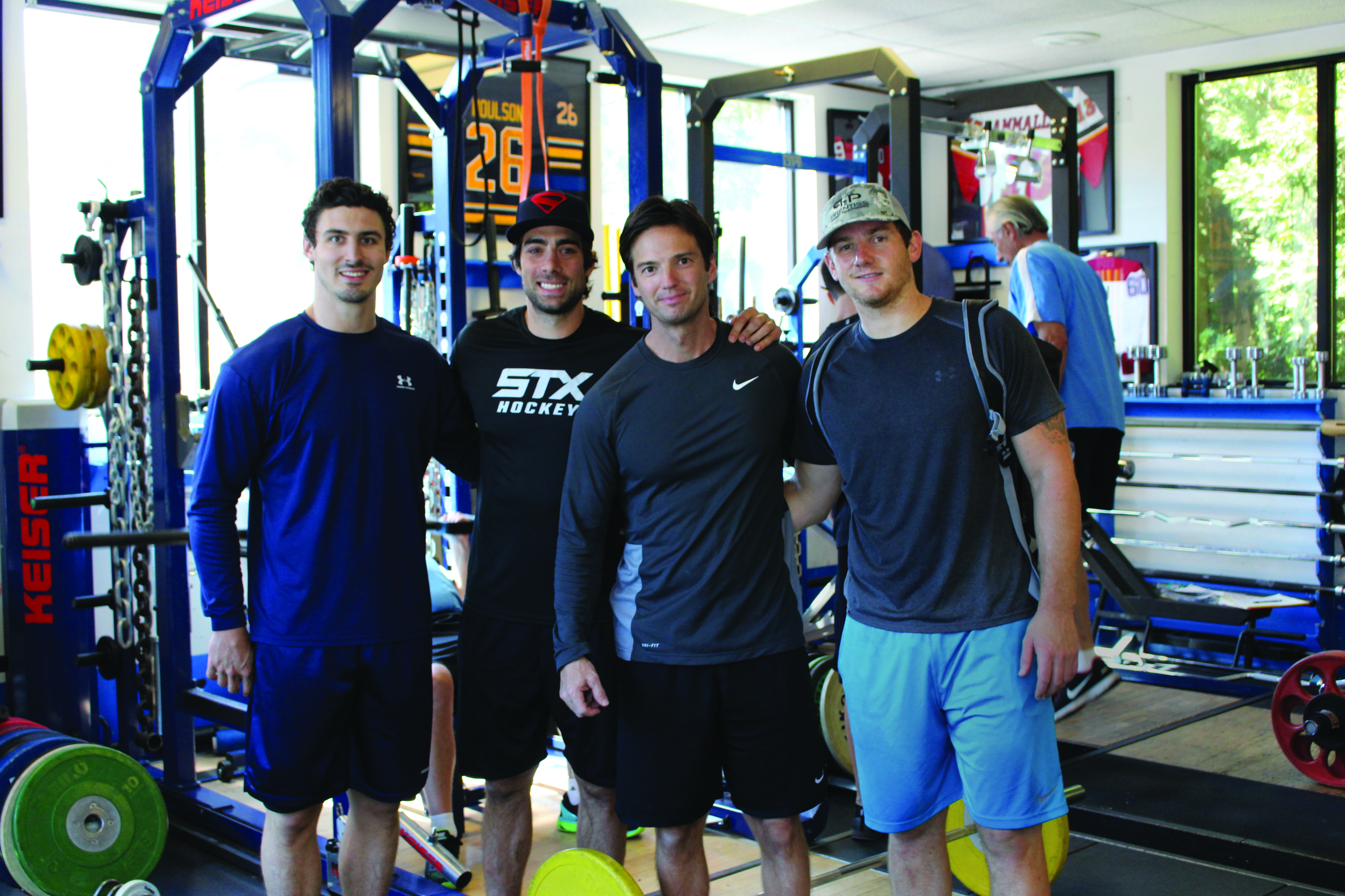 NHL players Chris Kreider, Matt Moulson and Jonathan Quick with Ben Prentiss