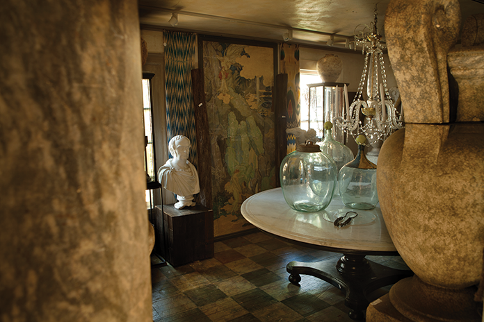 A vignette from Trapp’s shop includes a Dutch colonial table with an ebonized teak base and marble top, an antique oil-on-canvas panel and silk ikat textiles. The store is located on 7 River Road, West Cornwall, CT. 860-672-6098, michaeltrapp.com