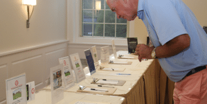 Matt McSharry looks at Silent Auction Items Greenwich Old Timers Association