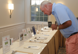 Matt McSharry looks at Silent Auction Items Greenwich Old Timers Association