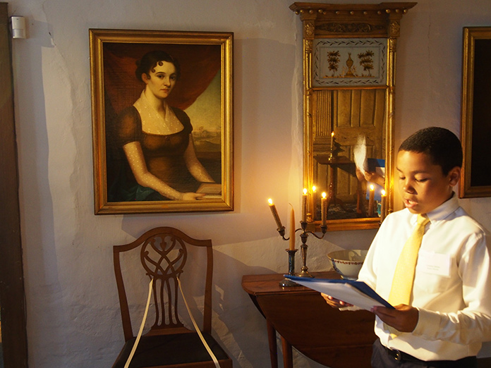 Hamilton-Ave-junior-docent reading in front of a painting.