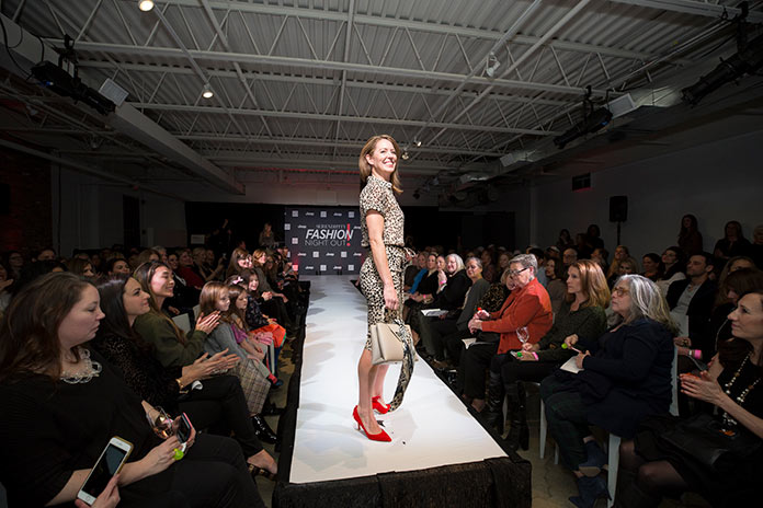 Ashley Stewart walking the runway for Fashion Night Out