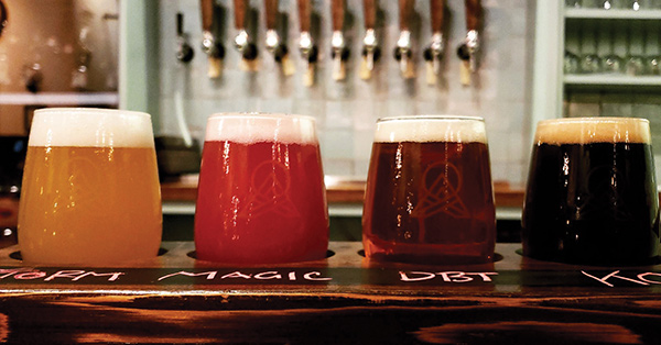 A flight of four beers in a row