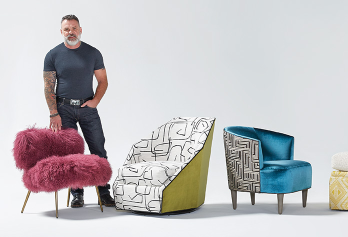 Founder Bob Williams standing with some recently released chairs
