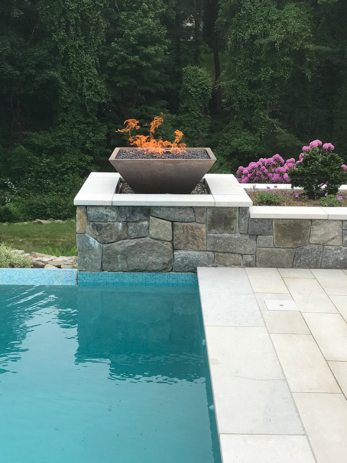 Firebowl lit near pool