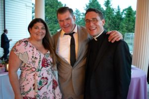 Image of Randy Lynn and Jim McManus, and Fr. Frank Prima