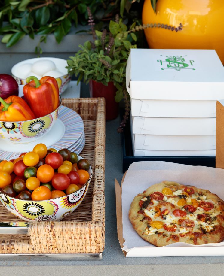 Pizza and vegetables on table