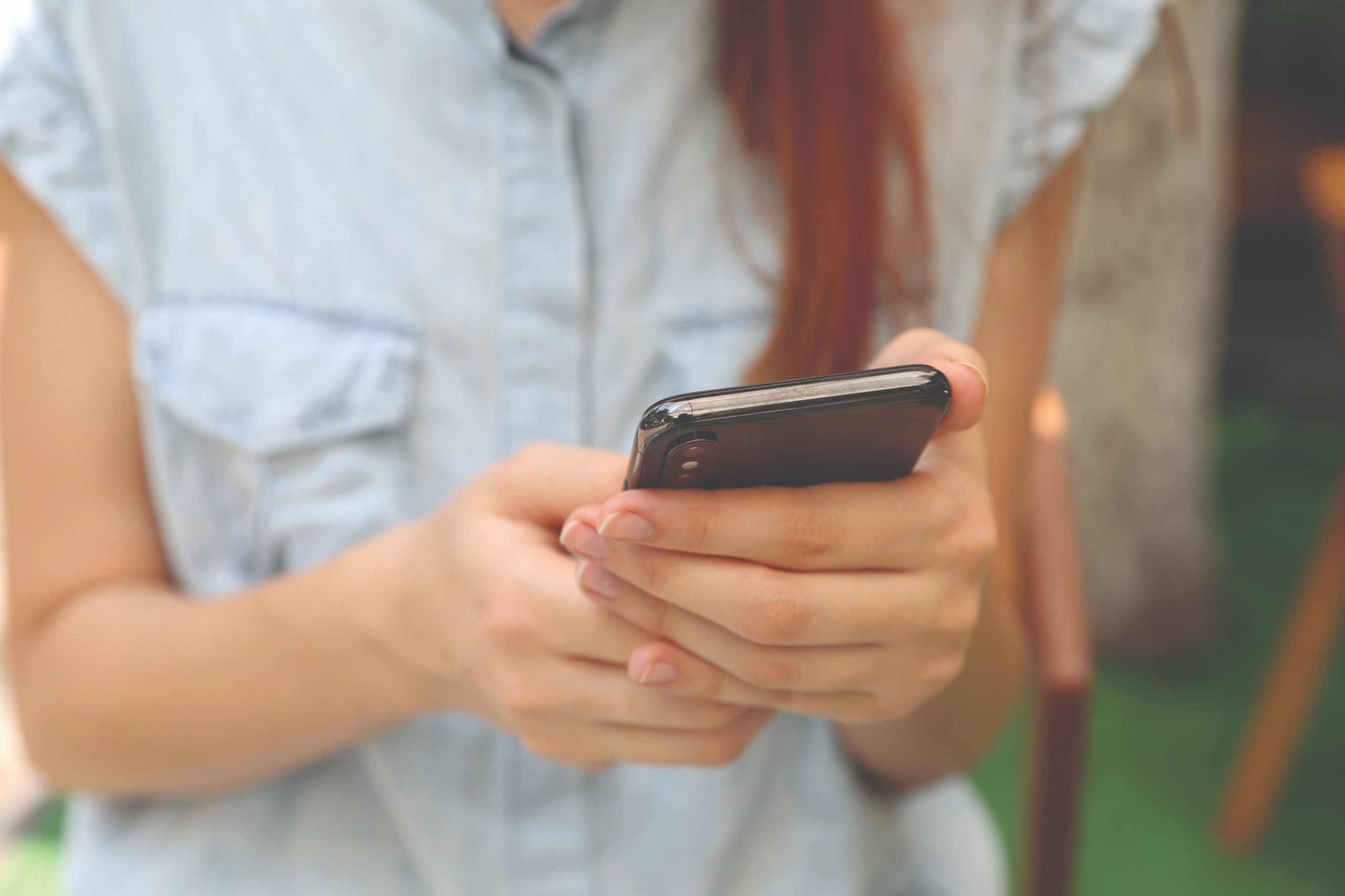 Girl holding cell phone