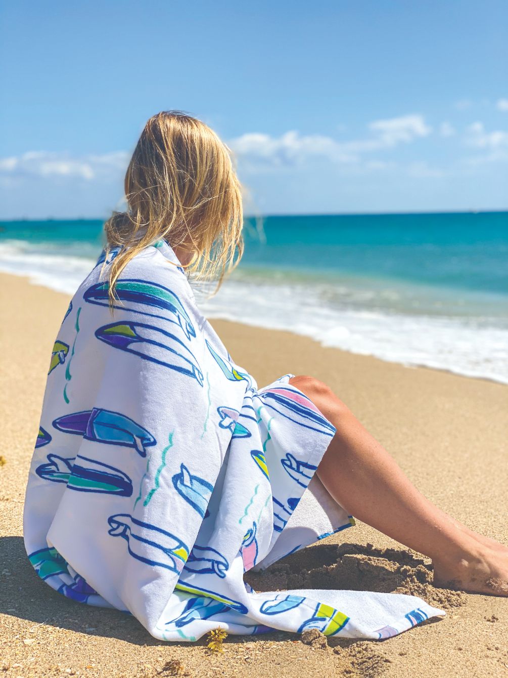 Girl on beach with towel